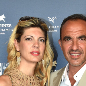 Exclusif - Nikos Aliagas et sa compagne Tina Grigoriou - Photocall du Longines Paris Eiffel Jumping au Champ de Mars à Paris le 7 juillet 2018. ©Veeren-Perusseau/Bestimage