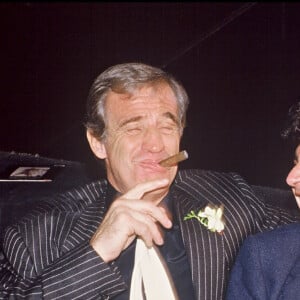 Archives - Jean-Paul Belmondo, sa compagne Carlos Sotto Mayor et Michel Boujenah fêtent la sortie de l'album de la chanteuse d'une soirée à Paris en 1985. 