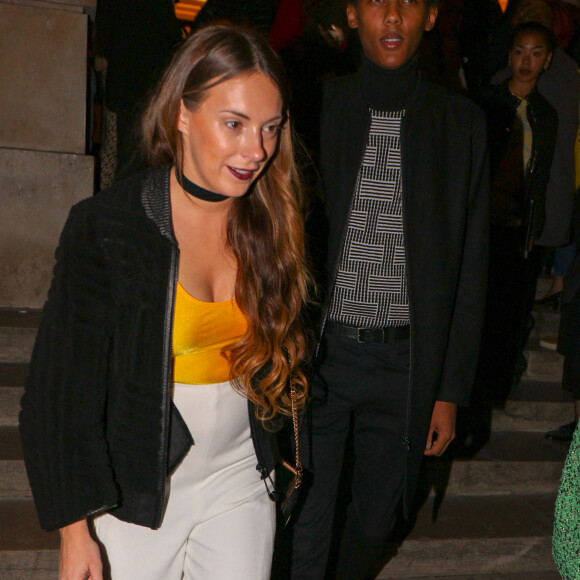 Le chanteur Stromae et sa femme Coralie Barbier au défilé de mode "Kenzo" collection prêt-à-porter Printemps-Eté 2017 lors de la Fashion Week de Paris à la Cité de l'architecture et du patrimoine au Trocadéro à Paris, France, le 4 octobre 2016. © Agence/Bestimage