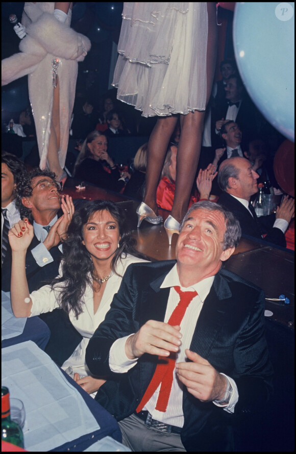 Jean-Paul Belmondo et Carlos Sotto Mayor en soirée à Paris en 1985.