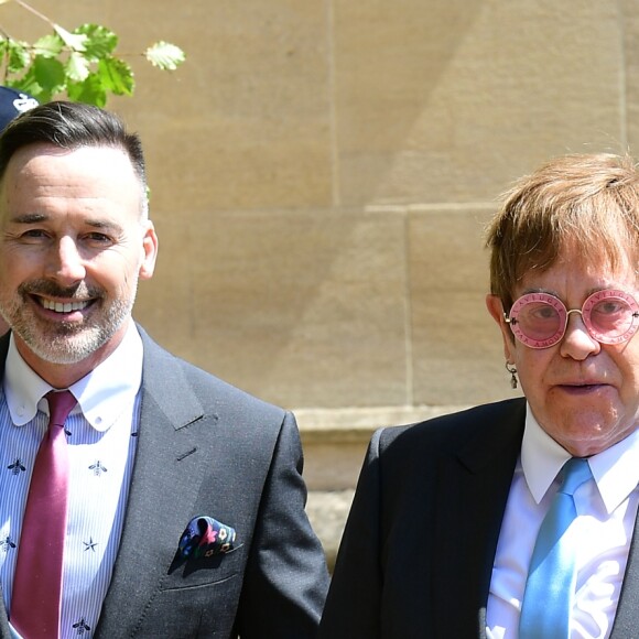 David Furnish et Elton John au mariage du prince Harry et Meghan Markle à la sortie de la chapelle St. George au château de Windsor, Royaume Uni, le 19 mai 2018.