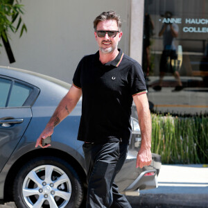 David Arquette sort d'un déjeuner avec son ex-femme Courteney Cox à West Hollywood, le 16 juillet 2014.