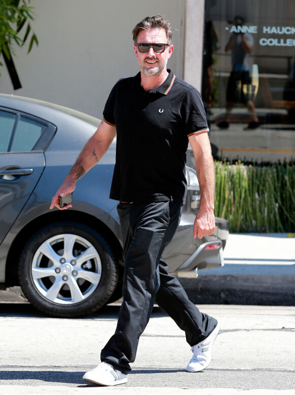 David Arquette sort d'un déjeuner avec son ex-femme Courteney Cox à West Hollywood, le 16 juillet 2014.