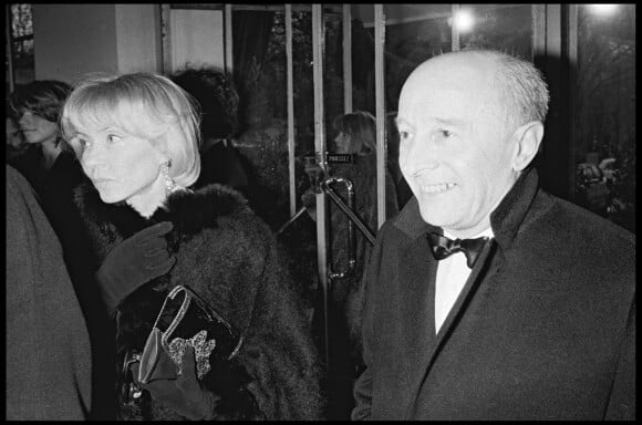 Archives - Michel Audiard et une amie lors de la soirée des "Best" à Paris. 1983.