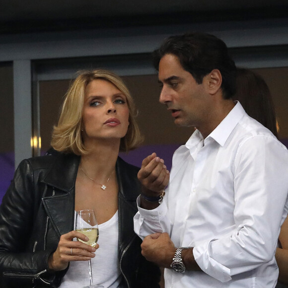 Sylvie Tellier (directrice générale de la Société Miss France et Miss France 2002) et son mari Laurent dans les tribunes du stade de France lors du match de ligue des nations opposant la France à l'Allemagne à Saint-Denis, Seine Saint-Denis, France, le 16 octobre 2018. La France a gagné 2-1.