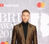 Calvin Harris au photocall de la cérémonie des Brit Awards 2019 à l'O2 Arena à Londres le 20 février 2019. 