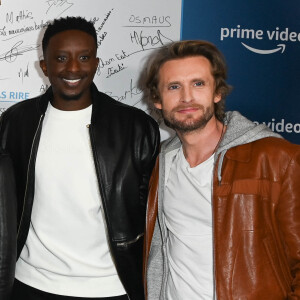 Ahmed Sylla et Philippe Lacheau - Présentation de la nouvelle saison du jeu "LOL : Qui Rit, Sort", qui sortira le 1er avril sur Amazon Prime, au Trianon à Paris. Le 24 mars 2022 © Coadic Guirec / Bestimage 