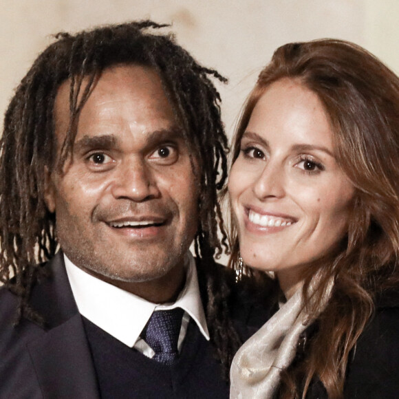 L'ancien footballeur français Christian Karembeu et sa femme Jacky Chamoun - Dîner au Palais de l'Elysée en l'honneur des 50 ans du Variétés Club de France, à Paris, le 14 octobre 2021. © Stéphane Lemouton / Bestimage