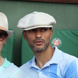 Audrey Fleurot et son nouveau compagnon Djibril Glissant assistent à la finale dame lors des Internationaux de France de tennis de Roland Garros à Paris le 7 juin 2014.