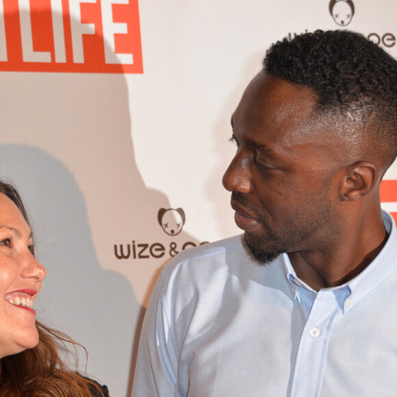 Thomas Ngijol et sa compagne Karole Rocher - Avant-première du film "Fastlife" au cinéma Gaumont Capucines Opéra à Paris, le 15 juillet 2014.