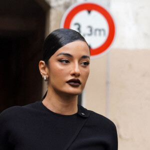 Amina Muaddi - Arrivées au défilé de mode automne-hiver 2022/2023 "Courrèges" lors de la fashion week de Paris. Le 2 mars 2022