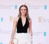 Emma Watson - Photocall de la cérémonie des BAFTA 2022 (British Academy Film Awards) au Royal Albert Hall à Londres le 13 mars 2022.