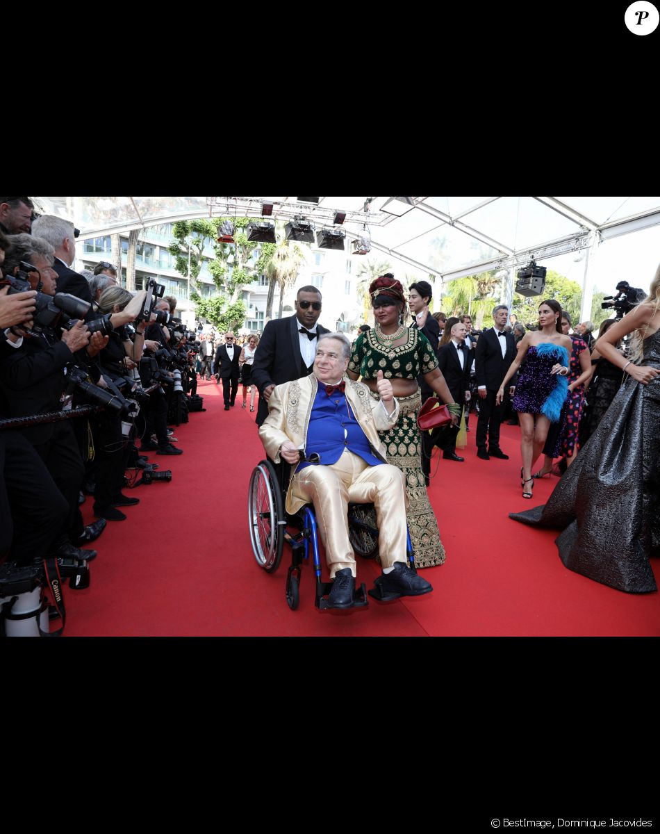 Paul Loup Sulitzer et sa compagne Supriya Answya Devi Rathoar - Montée des marches du film " Triangle of Sadness (Sans filtre) " lors du 75ème Festival International du Film de Cannes. Le 21 mai 2022 © Dominique Jacovides / Bestimage