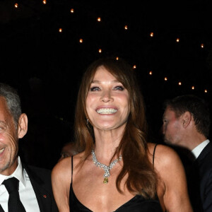 Carla Bruni et son mari Nicolas Sarkozy à la soirée "Women In Motion" par Kering au Château de la Castre lors du 75ème Festival International du Film de Cannes, le 22 mai 2022. 