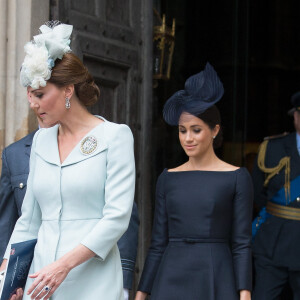 Kate Catherine Middleton, duchesse de Cambridge, Meghan Markle, duchesse de Sussex (habillée en Dior Haute Couture par Maria Grazia Chiuri) - La famille royale d'Angleterre à la sortie de l'abbaye de Westminster pour le centenaire de la RAF à Londres.