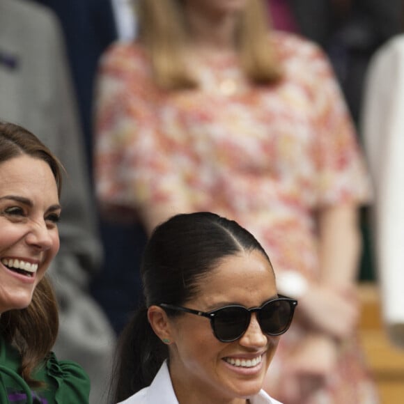 Catherine (Kate) Middleton, duchesse de Cambridge, Meghan Markle, duchesse de Sussex, et Pippa Middleton dans les tribunes lors de la finale femme de Wimbledon "Serena Williams - Simona Halep (2/6 - 2/6) à Londres, le 13 juillet 2019.