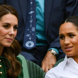 Archives - Catherine (Kate) Middleton, duchesse de Cambridge, Meghan Markle, duchesse de Sussex, sont dans les tribunes lors de la finale femme de Wimbledon "Serena Williams - Simona Halep (2/6 - 2/6) à Londres le 13 juillet 2019. © Chryslène Caillaud / Panoramic / Bestimage