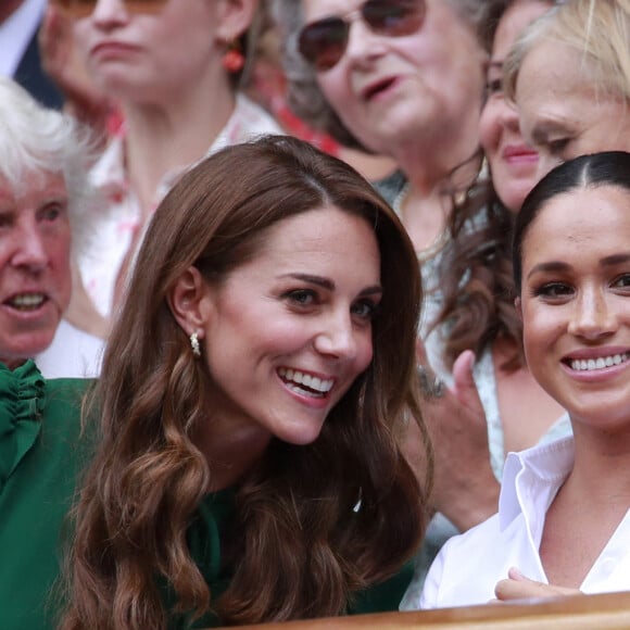 Catherine (Kate) Middleton, duchesse de Cambridge, Meghan Markle, duchesse de Sussex, et Pippa Middleton dans les tribunes lors de la finale femme de Wimbledon "Serena Williams - Simona Halep (2/6 - 2/6) à Londres, le 13 juillet 2019.