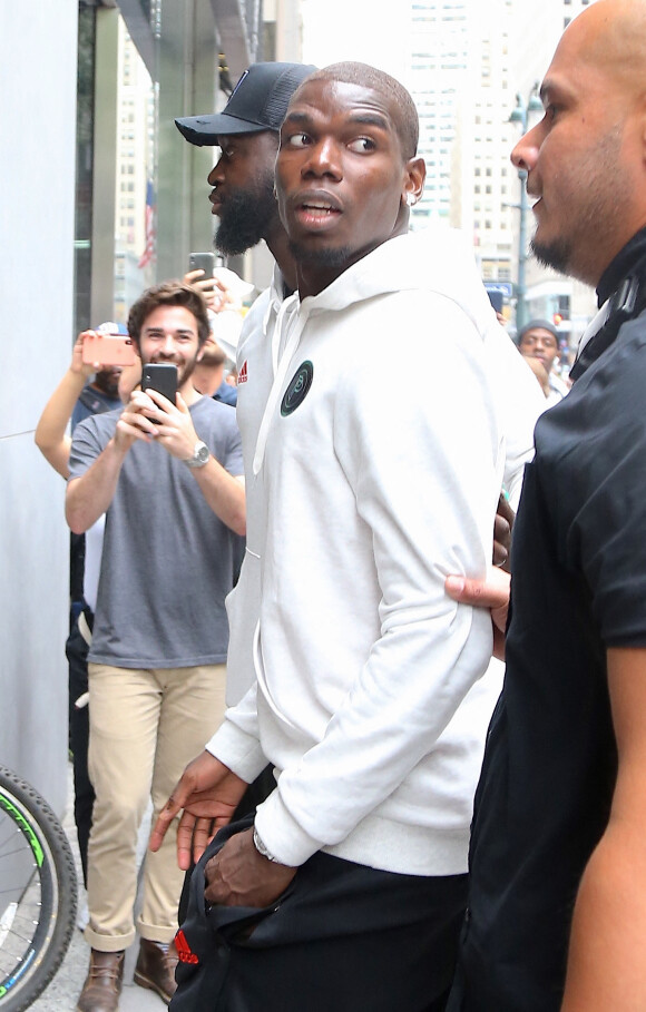Exclusif - Paul Pogba arrive accompagné de sa femme Maria Salaues, de leur fils et d'autres membres de sa famille dans le magasin 'Adidas' sur la 5ème Avenue à New York, le 2 juillet 2019.