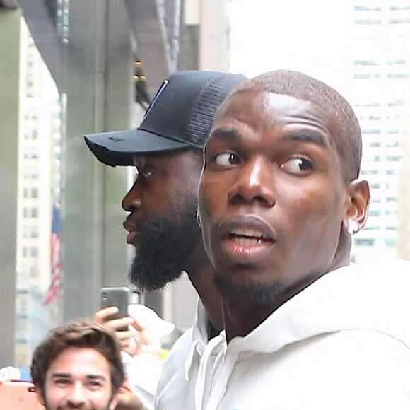 Exclusif - Paul Pogba arrive accompagné de sa femme Maria Salaues, de leur fils et d'autres membres de sa famille dans le magasin 'Adidas' sur la 5ème Avenue à New York, le 2 juillet 2019.