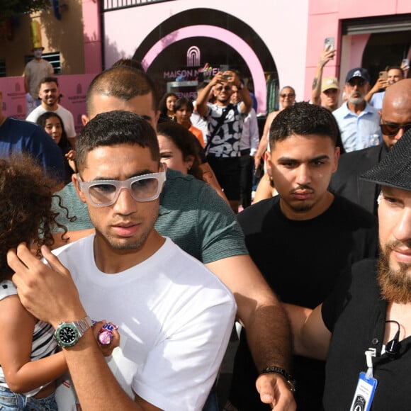 Exclusif - Nawel Debbouze, Achraf Hakimi avec sa fille - Inauguration de l'institut de beauté "Maison Nawel" à Marrakech au Maroc le 17 juin 2022. Sur 800 m2 d'espace intérieur et extérieur "Maison Nawel" est le plus grand salon de beauté au Maroc. Un institut dédié à la femme avec une expertise certaine sur l'ensemble des métiers de la beauté onglerie, coiffure, bar à sourcils, SPA et soins du corps et du visage. L'institut dispose également d'un salon privé VIP ainsi qu'un espace pour enfants afin d'occuper vos petits pendant que vous êtes chouchou par nos esthéticiennes beauté. Un concept store a également été pensé pour mettre en avant des pièces uniques de jeunes créateurs de tous bords, de différentes nationalités. © Rachid Bellak/Bestimage