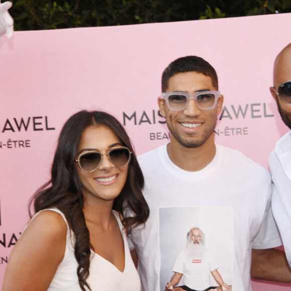 Exclusif - Nawel Debbouze avec son mari Fouad Ben Kouider, Achraf Hakimi - Inauguration de l'institut de beauté "Maison Nawel" à Marrakech au Maroc le 17 juin 2022. Sur 800 m2 d'espace intérieur et extérieur "Maison Nawel" est le plus grand salon de beauté au Maroc. Un institut dédié à la femme avec une expertise certaine sur l'ensemble des métiers de la beauté onglerie, coiffure, bar à sourcils, SPA et soins du corps et du visage. L'institut dispose également d'un salon privé VIP ainsi qu'un espace pour enfants afin d'occuper vos petits pendant que vous êtes chouchou par nos esthéticiennes beauté. Un concept store a également été pensé pour mettre en avant des pièces uniques de jeunes créateurs de tous bords, de différentes nationalités. © Rachid Bellak/Bestimage