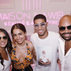 Exclusif - Nawel Debbouze avec son mari Fouad Ben Kouider, Achraf Hakimi et sa femme Hiba Abouk - Inauguration de l'institut de beauté "Maison Nawel" à Marrakech au Maroc le 17 juin 2022. Sur 800 m2 d'espace intérieur et extérieur "Maison Nawel" est le plus grand salon de beauté au Maroc. Un institut dédié à la femme avec une expertise certaine sur l'ensemble des métiers de la beauté onglerie, coiffure, bar à sourcils, SPA et soins du corps et du visage. L'institut dispose également d'un salon privé VIP ainsi qu'un espace pour enfants afin d'occuper vos petits pendant que vous êtes chouchou par nos esthéticiennes beauté. Un concept store a également été pensé pour mettre en avant des pièces uniques de jeunes créateurs de tous bords, de différentes nationalités. © Rachid Bellak/Bestimage