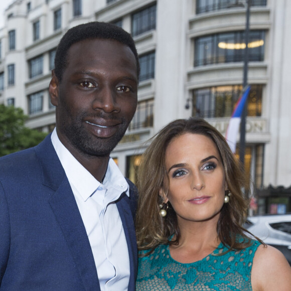 Omar Sy et sa femme Hélène boucles d'oreilles Messika) - Première du film "Jurassic World" à l'Ugc Normandie à Paris le 29 mai 2015. 