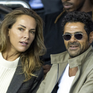 Jamel Debbouze et Mélissa Theuriau assistent au match aller de la Ligue des Champions entre le Paris Saint-Germain contre la Juventus (2-1) au Parc des Princes à Paris.