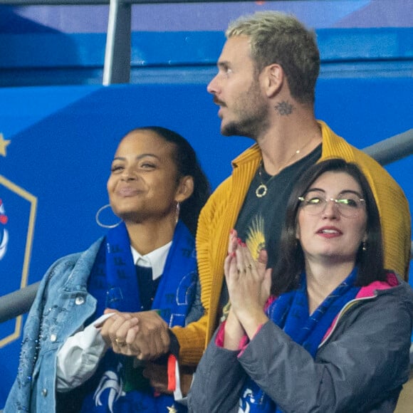 M. Pokora (Matt Pokora), sa femme Christina Milian assistent au match de la 5ème et avant-dernière journée de Ligue des nations entre la France et l'Autriche (2-0) au Stade de France à Saint-Denis le 22 septembre 2022. 