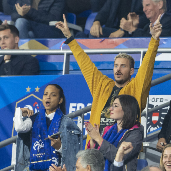 M. Pokora (Matt Pokora), sa femme Christina Milian assistent au match de la 5ème et avant-dernière journée de Ligue des nations entre la France et l'Autriche (2-0) au Stade de France à Saint-Denis le 22 septembre 2022. 