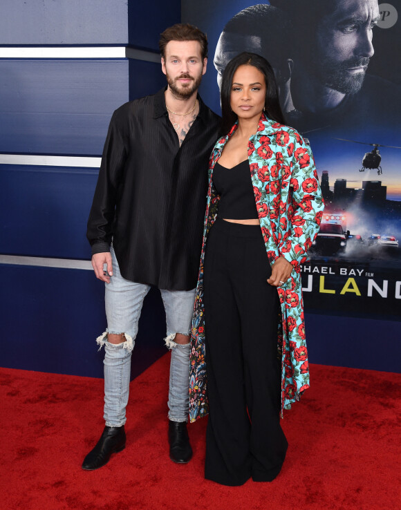 Christina Milian et son mari Matt Pokora au photocall de la première du film "Ambulance" à Los Angeles le 4 avril 2022. 