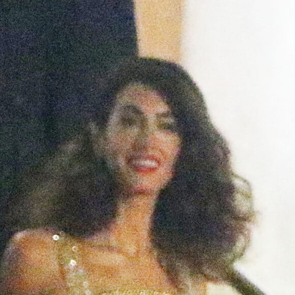 Amal Clooney et son mari George Clooney à la soirée "The Clooney Foundation For Justice" à la bibliothèque publique de New York, le 29 septembre 2022. 