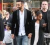 La Fouine, sa fille Fatima (à droite) et sa nièce arrivent à l'avant-première du film "A toute épreuve" lors du Festival des Champs-Elysées. Paris, le 13 juin 2014.