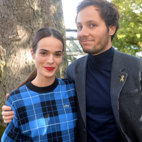 Vianney Bureau (Vianney), sa compagne Catherine Robert - People au défilé Lacoste Collection Prêt-à-Porter Printemps/Eté lors de la Fashion Week de Paris. © Veeren Ramsamy-Christophe Clovis/Bestimage 