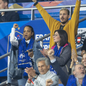 M. Pokora (Matt Pokora), sa femme Christina Milian assistent au match de la 5ème et avant-dernière journée de Ligue des nations entre la France et l'Autriche (2-0) au Stade de France à Saint-Denis le 22 septembre 2022. 