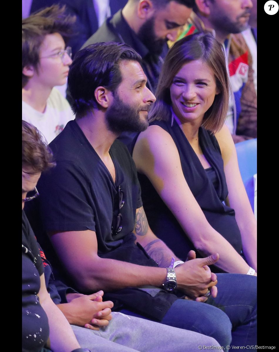 Maxim Nucci (Yodelice) et sa compagne enceinte Isabelle Ithurburu - Maxim Nucci (Yodelice) et sa compagne enceinte Isabelle Ithurburu assistent au match de boxe de Tony Yoka au palais des sports de Paris, le 23 juin 2018 © Veeren-CVS/Bestimage
