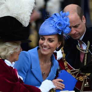 Le prince William, duc de Cambridge, et Catherine (Kate) Middleton, duchesse de Cambridge, Camilla Parker Bowles, duchesse de Cornouailles, lors de la cérémonie de l'ordre de la Jarretière à la chapelle Saint-Georges du château de Windsor. Cette année pour la première fois Camilla Parker Bowles, duchesse de Cornouailles, a été investie comme nouveau chevalier de l'ordre de la Jarretière par la reine et a pu participer à la procession au côté du prince Charles. Londres, la 13 juin 2022. 
