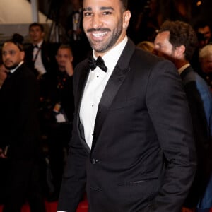 Adil Rami - Montée des marches du film "Novembre" lors du 75ème Festival International du Film de Cannes, le 22 mai 2022. © Cyril Moreau / Bestimage