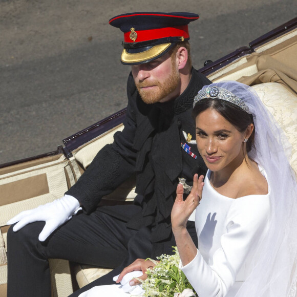 Le prince Harry, duc de Sussex, et Meghan Markle, duchesse de Sussex, en calèche au château de Windsor après la cérémonie de leur mariage au château de Windsor, Royaume Uni, le 19 mai 2018. 