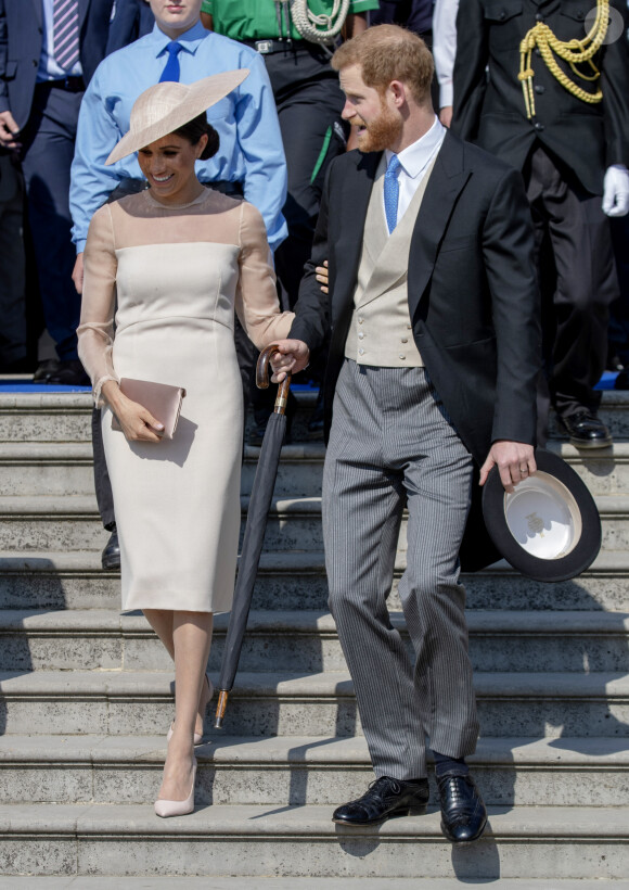 Le prince Harry, duc de Sussex, et Meghan Markle, duchesse de Sussex, lors de la garden party pour les 70 ans du prince Charles au palais de Buckingham à Londres. Le 22 mai 2018 