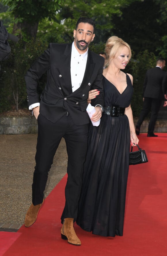 Adil Rami et sa compagne Pamela Anderson arrivent à la 28ème cérémonie des trophées UNFP (Union nationale des footballeurs professionnels) au Pavillon d'Armenonville à Paris, France, le 19 mai 2019. © Coadic Guirec/Bestimage