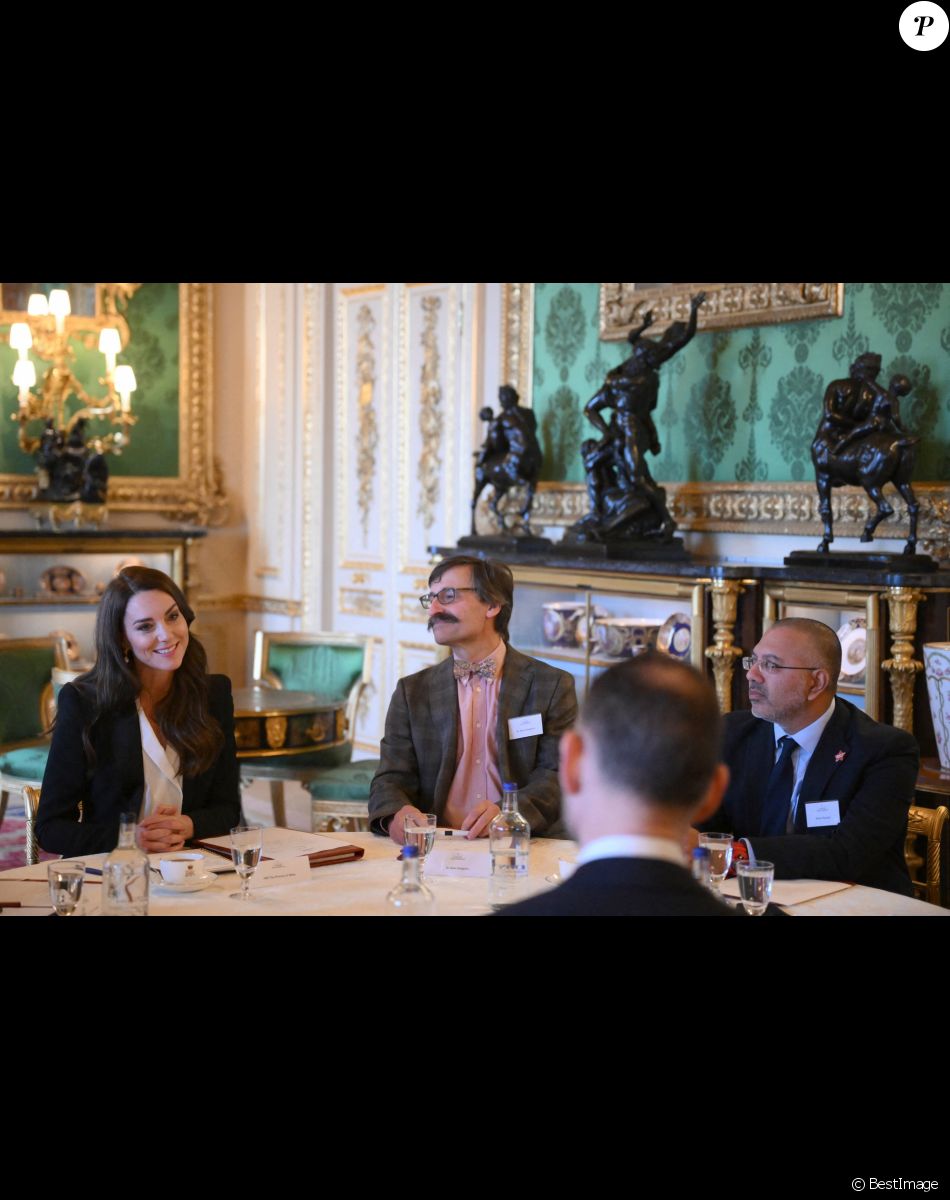 Catherine (Kate) Middleton, princesse de Galles, lors d'une réunion avec des experts du milieu universitaire, des sciences et du secteur de la petite enfance au château de Windsor, le 25 janvier 2023.