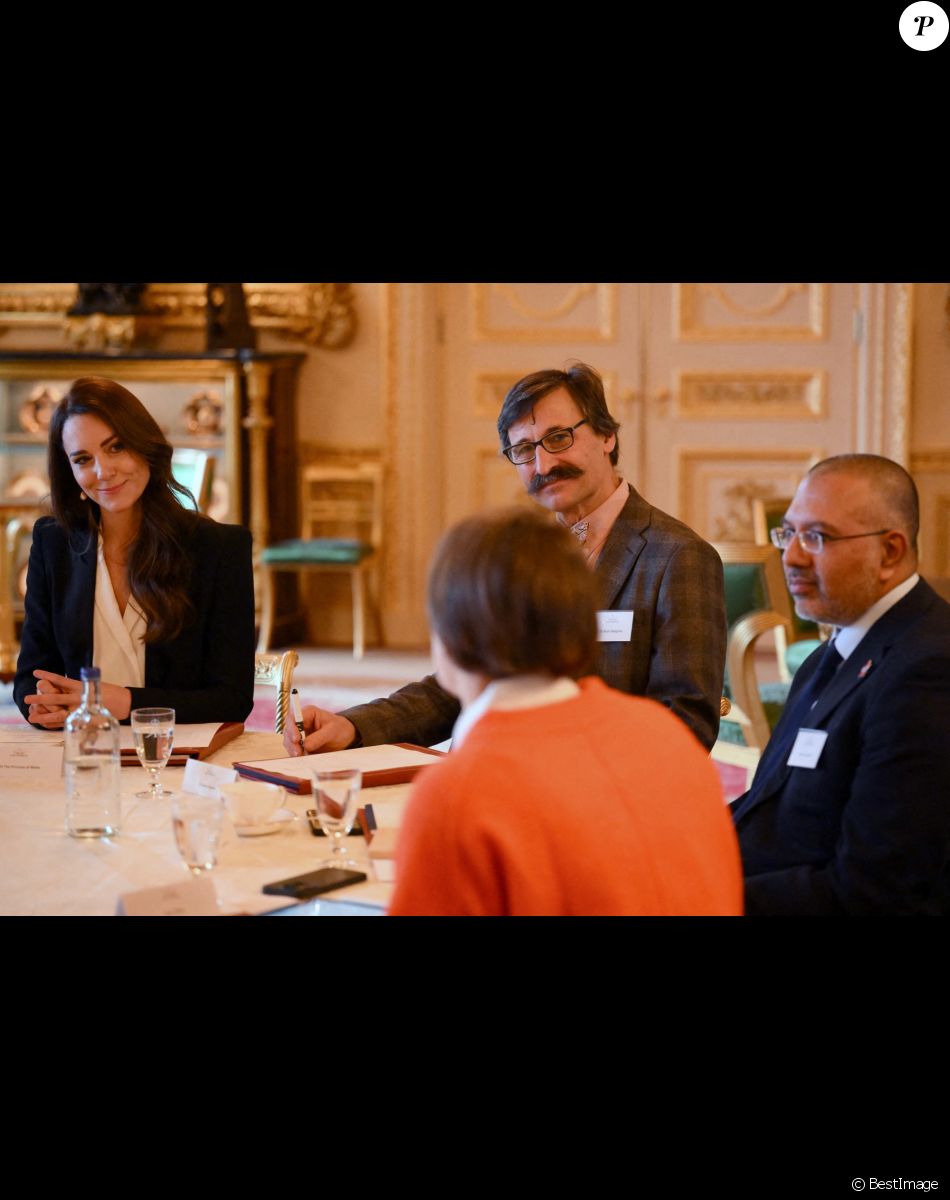 Catherine (Kate) Middleton, princesse de Galles, lors d'une réunion avec des experts du milieu universitaire, des sciences et du secteur de la petite enfance au château de Windsor, le 25 janvier 2023.