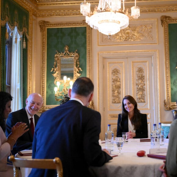 Catherine (Kate) Middleton, princesse de Galles, lors d'une réunion avec des experts du milieu universitaire, des sciences et du secteur de la petite enfance au château de Windsor, le 25 janvier 2023. 