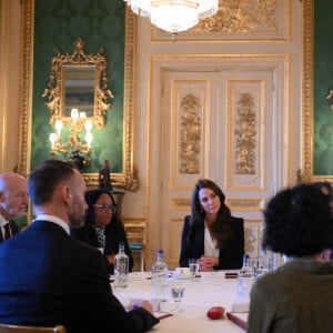 Catherine (Kate) Middleton, princesse de Galles, lors d'une réunion avec des experts du milieu universitaire, des sciences et du secteur de la petite enfance au château de Windsor, le 25 janvier 2023. 