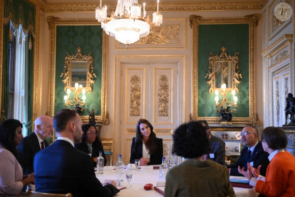 Catherine (Kate) Middleton, princesse de Galles, lors d'une réunion avec des experts du milieu universitaire, des sciences et du secteur de la petite enfance au château de Windsor, le 25 janvier 2023. 