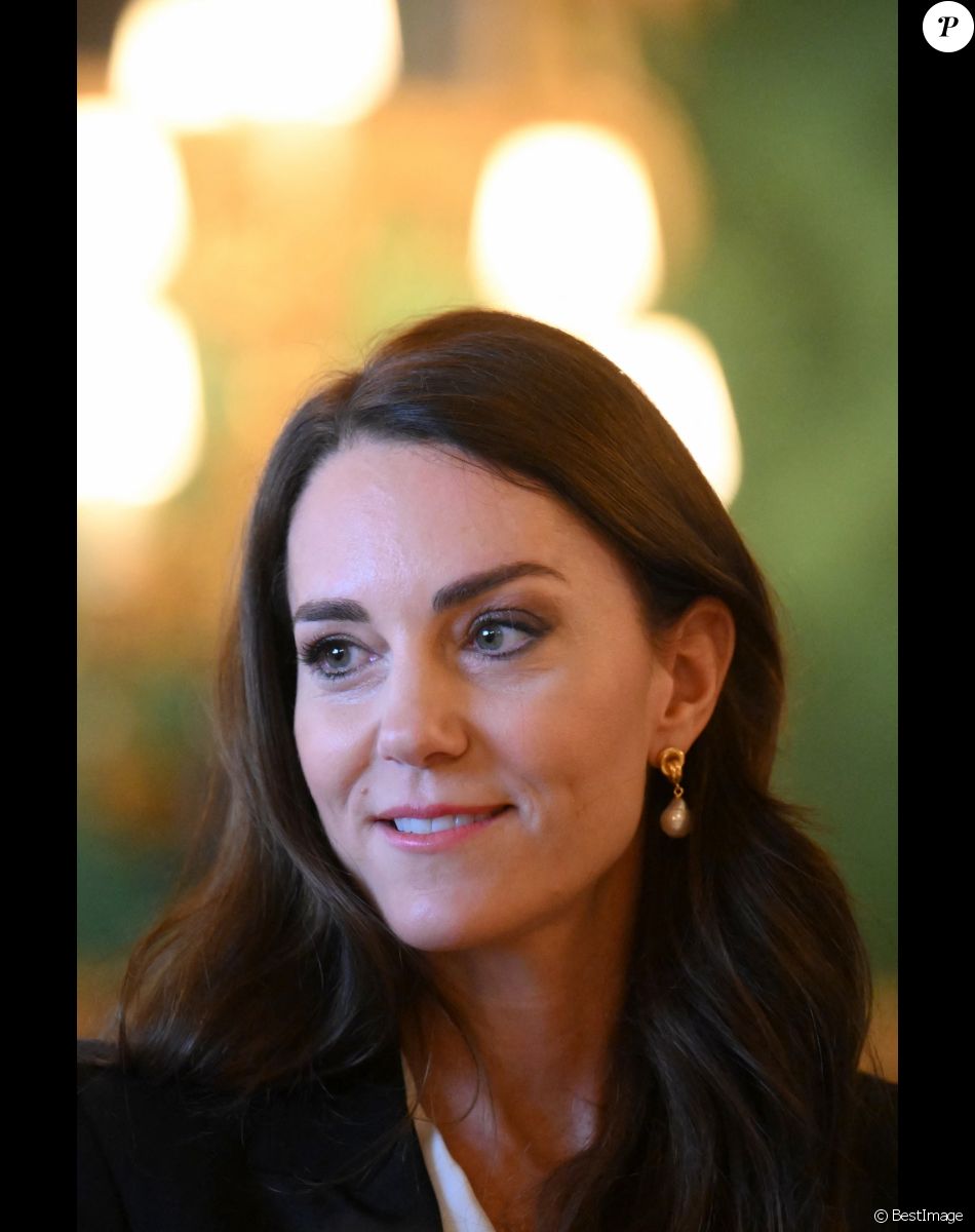 Catherine (Kate) Middleton, princesse de Galles, lors d'une réunion avec des experts du milieu universitaire, des sciences et du secteur de la petite enfance au château de Windsor, le 25 janvier 2023.