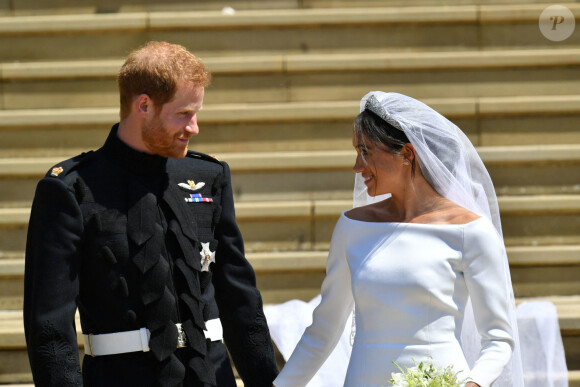 Le prince Harry, duc de Sussex, et Meghan Markle, duchesse de Sussex, à la sortie de chapelle St. George au château de Windsor - Sortie après la cérémonie de mariage du prince Harry et de Meghan Markle en la chapelle Saint-George au château de Windsor, Royaume Uni, le 19 mai 2018. 