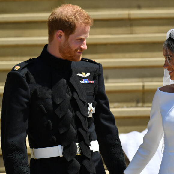 Le prince Harry, duc de Sussex, et Meghan Markle, duchesse de Sussex, à la sortie de chapelle St. George au château de Windsor - Sortie après la cérémonie de mariage du prince Harry et de Meghan Markle en la chapelle Saint-George au château de Windsor, Royaume Uni, le 19 mai 2018. 